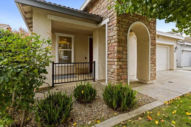 a view of a house with a flower garden