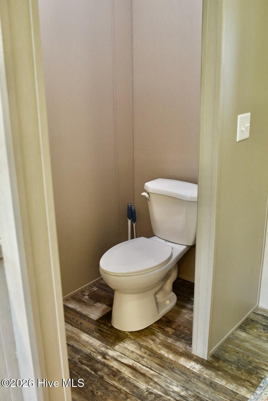 1430 Nixonton Road Elizabeth City, NC 27909 - Photo 20 of 30 The primary suite bathroom offers a private toilet area.