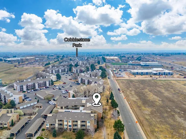 an aerial view of residential houses with outdoor space