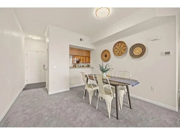 a view of a dining room and kitchen