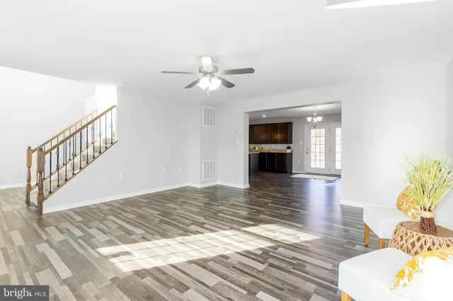 a view of a living room and wooden floor
