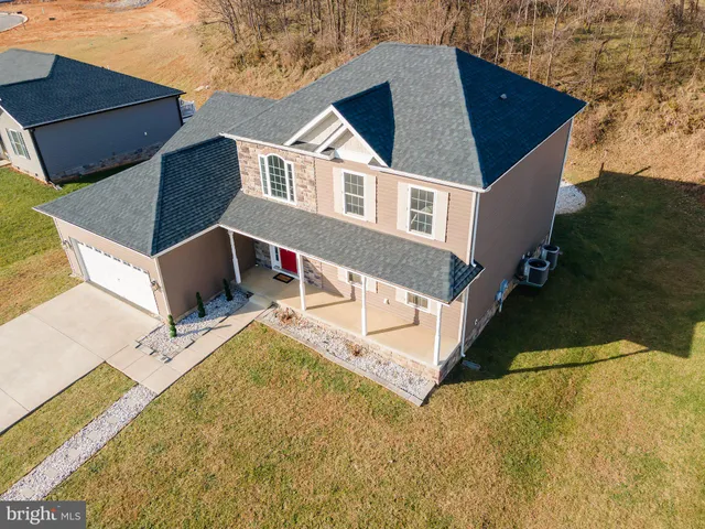 a aerial view of a house with swimming pool