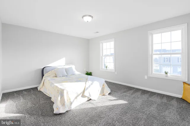 a bathroom with a double vanity sink mirror and toilet