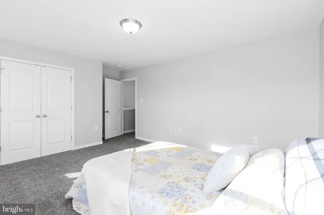 a living room with furniture and potted plant