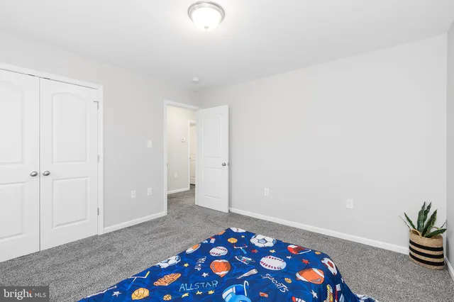 a view of a room with wooden walls