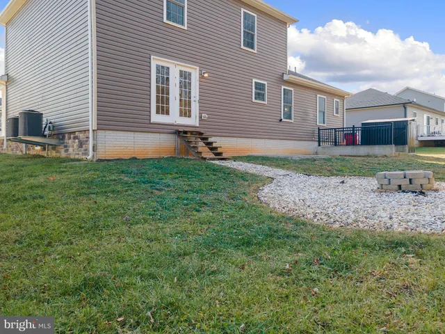 a backyard of a house with lots of green space