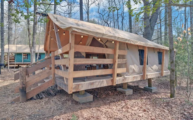 a backyard of a house with barbeque oven and bench