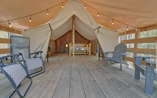 a view of a house with a yard and wooden fence