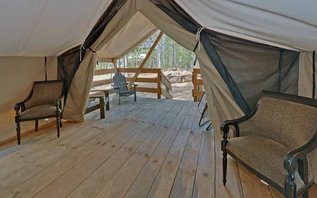 a bedroom with furniture and a wooden floor