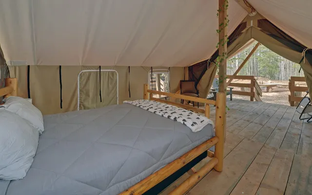 a bedroom with furniture and a window