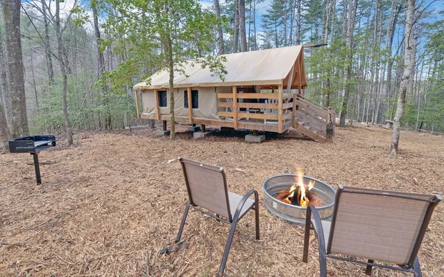 a living room with lots of furniture and wooden floors