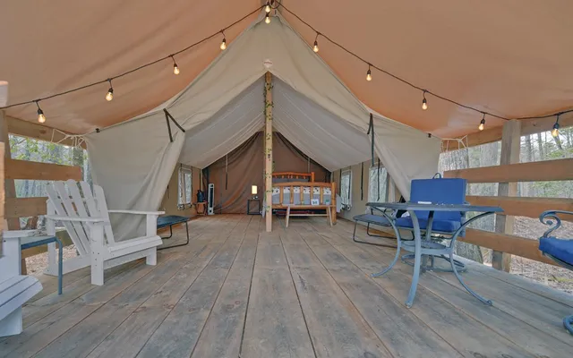 a bedroom with a bed and a table