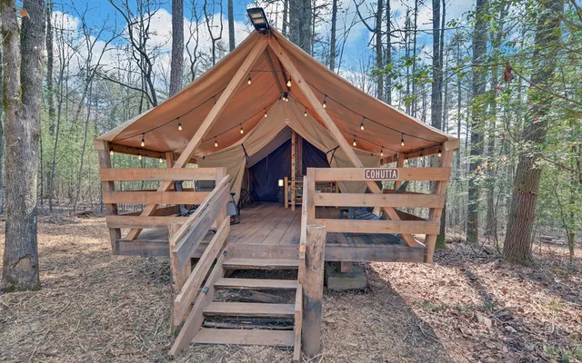 a view of a house with swimming pool and sitting area