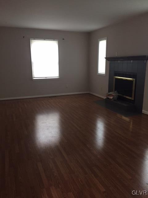 4437 Greenfield Road Bethlehem, PA 18017 - Photo 16 of 21 Liiving room has a wood burning fireplace and load