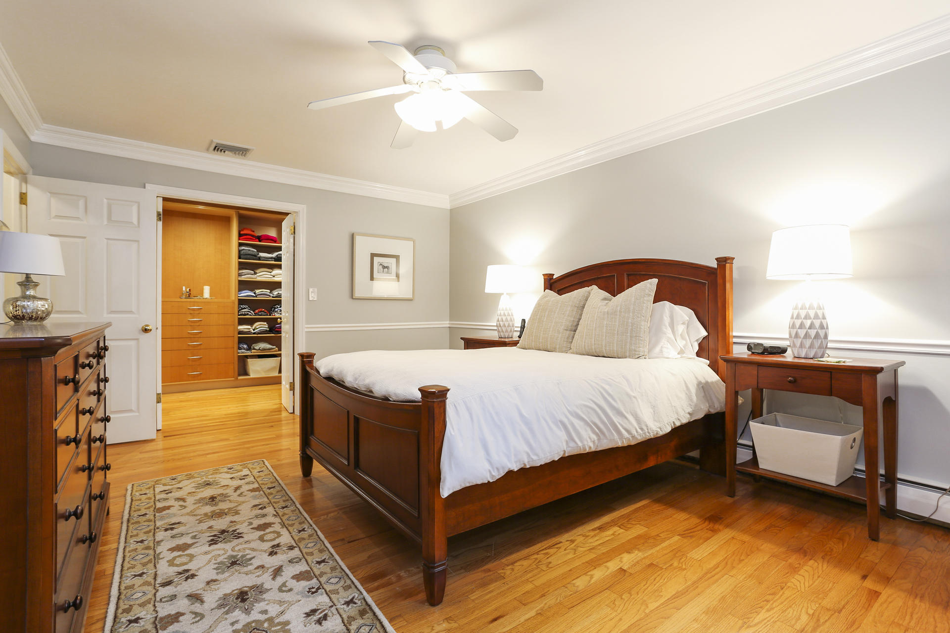 19 Middlesex Road Darien, CT 06820 - Photo 16 of 37 a spacious bedroom with a bed and a chandelier