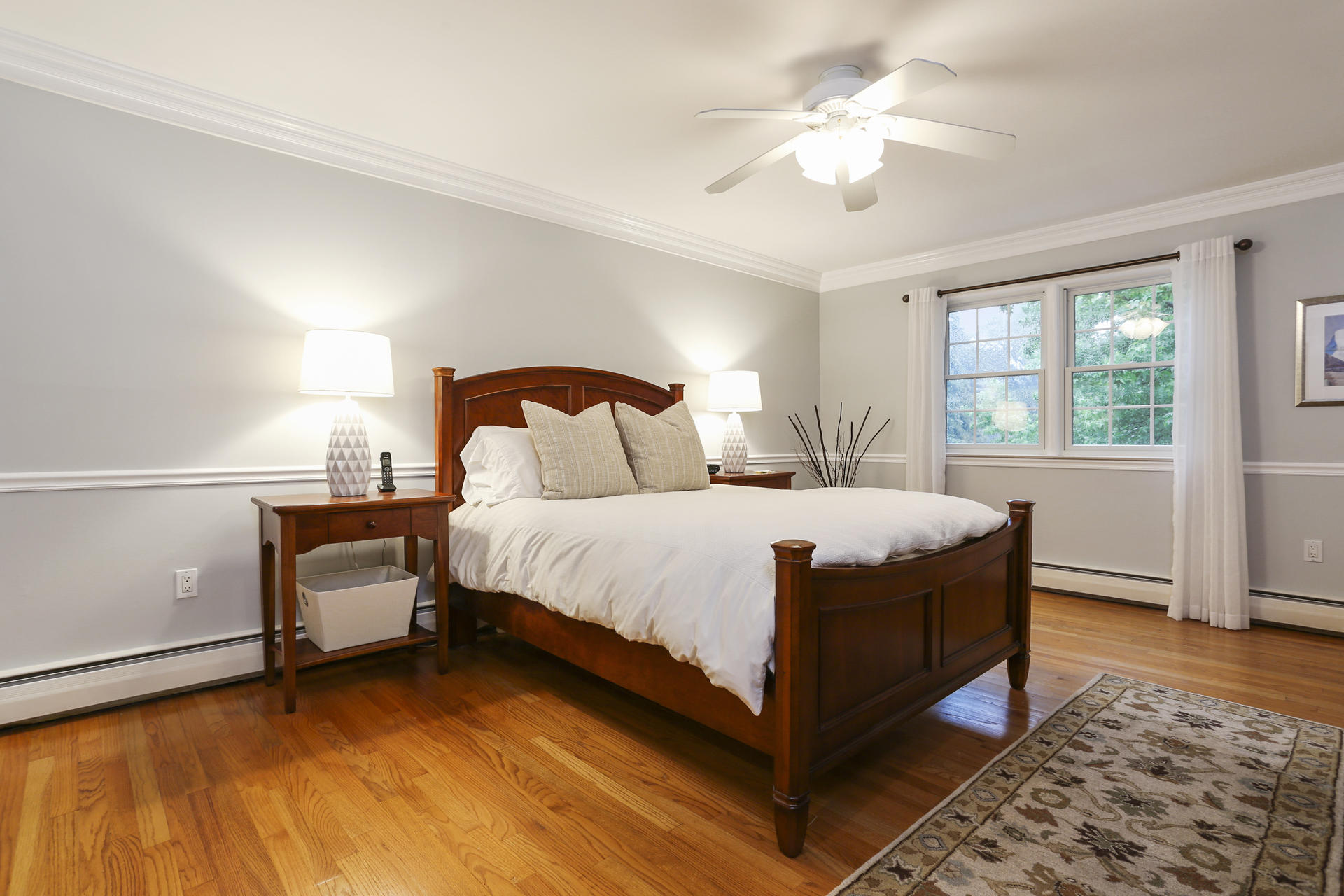 19 Middlesex Road Darien, CT 06820 - Photo 17 of 37 a bedroom with a bed and a ceiling fan