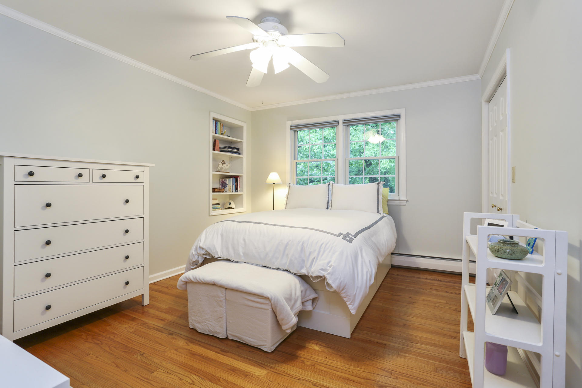 19 Middlesex Road Darien, CT 06820 - Photo 22 of 37 a spacious bedroom with a bed and a chandelier