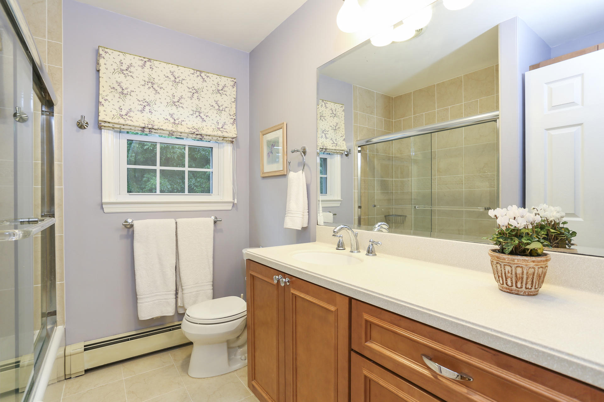 19 Middlesex Road Darien, CT 06820 - Photo 25 of 37 a bathroom with a sink a toilet and a mirror