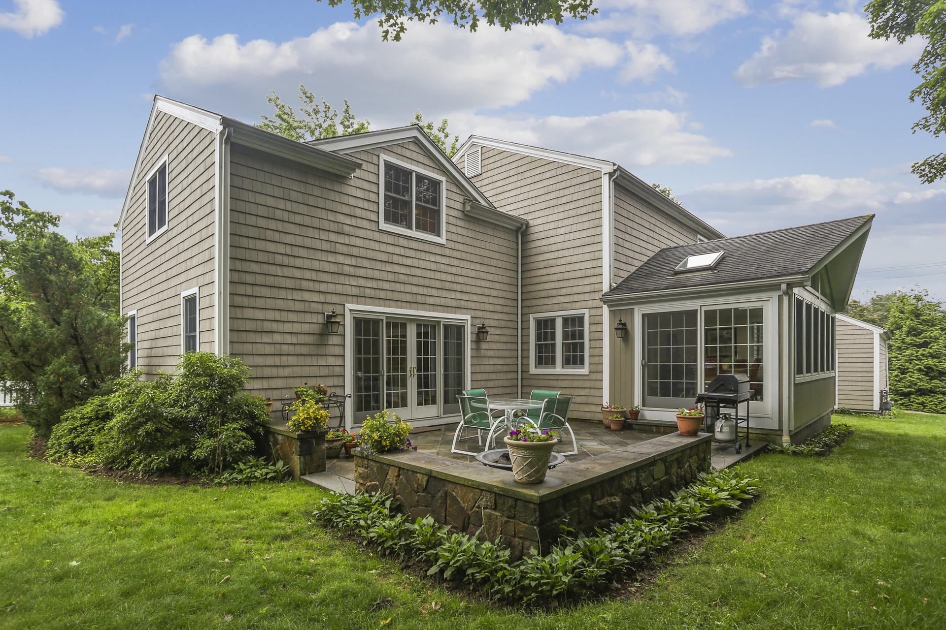 19 Middlesex Road Darien, CT 06820 - Photo 29 of 37 a front view of house with a garden and patio
