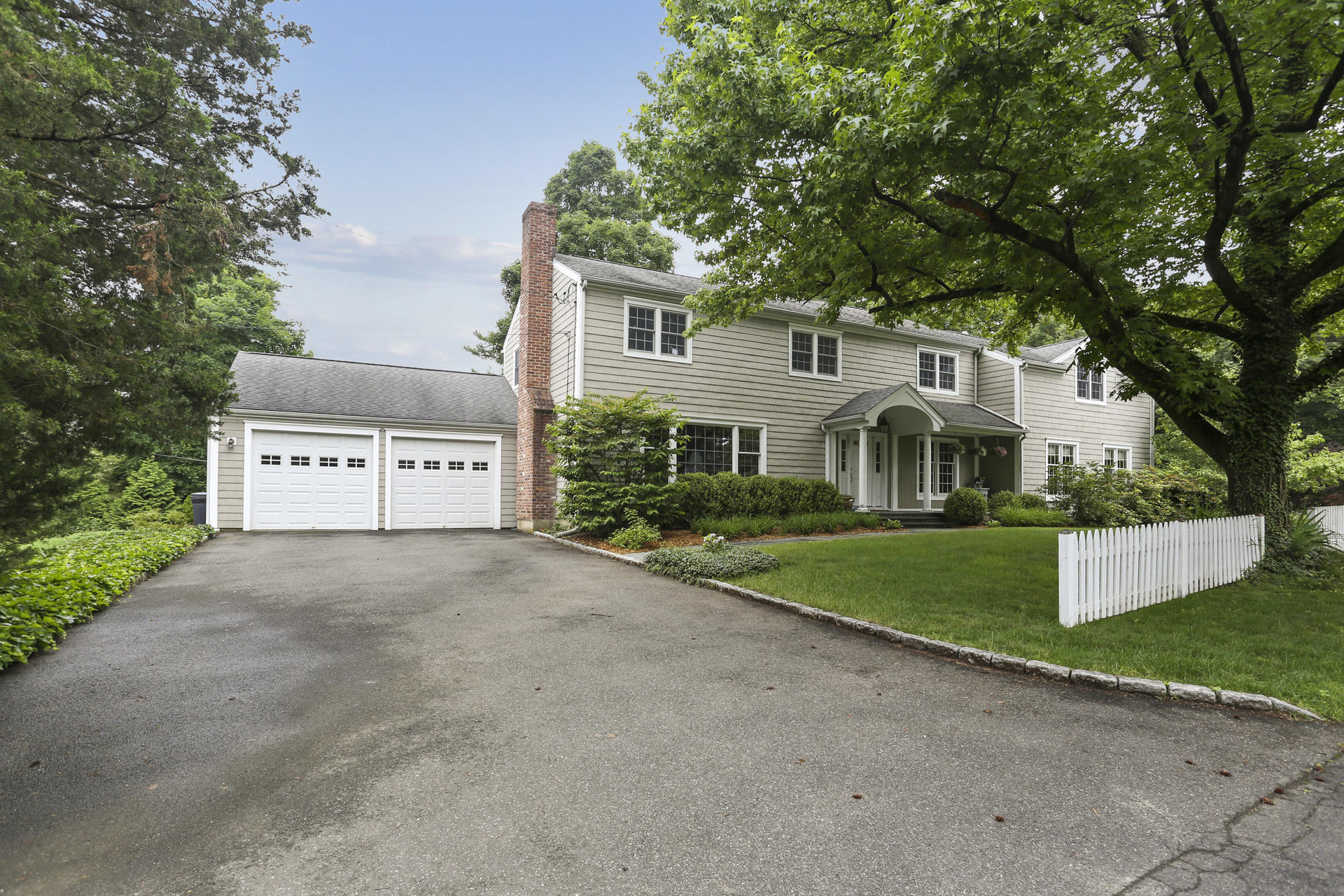 19 Middlesex Road Darien, CT 06820 - Photo 32 of 37 a view of a white house with a yard and large tree