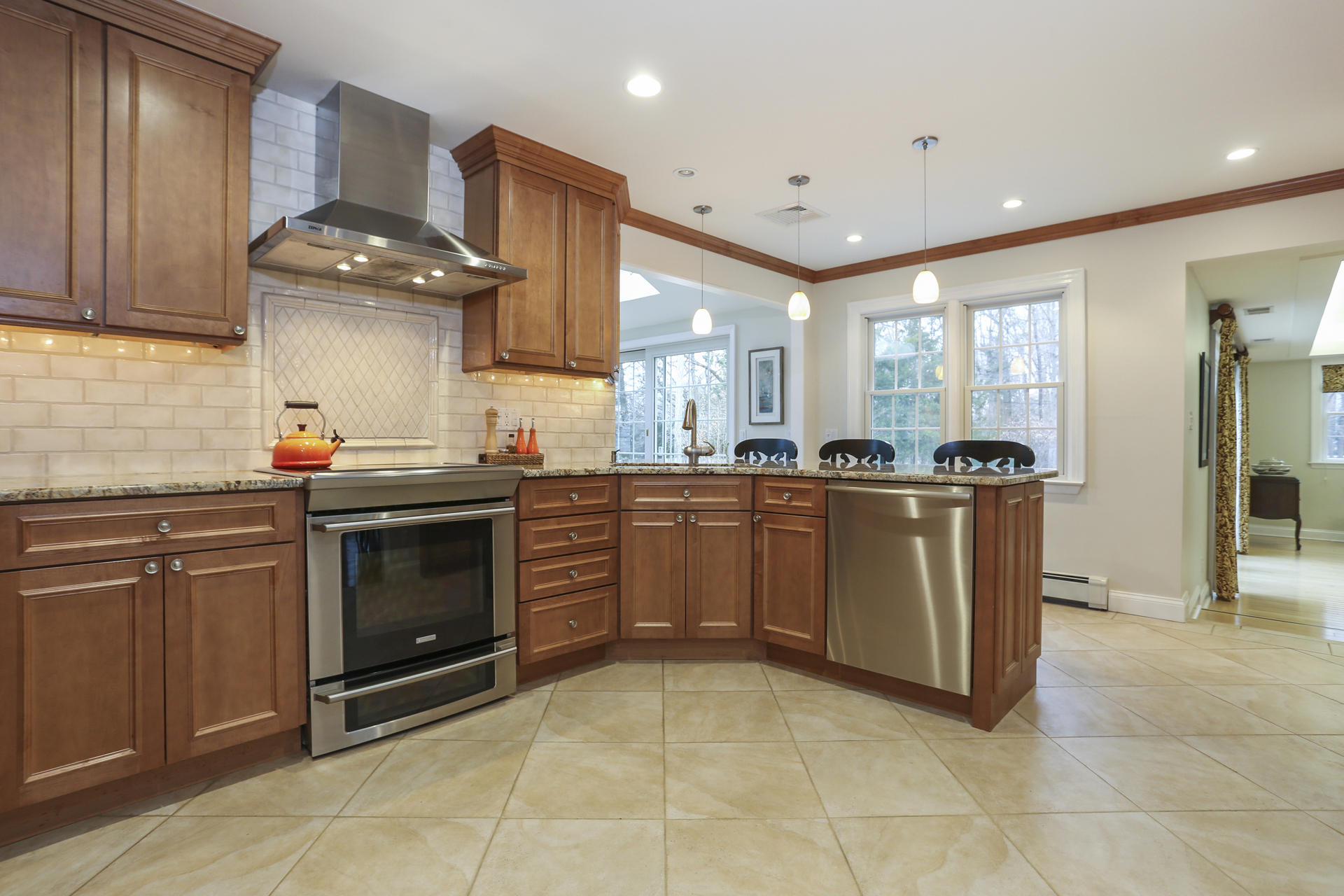 19 Middlesex Road Darien, CT 06820 - Photo 6 of 37 a kitchen with stainless steel appliances granite countertop a stove a sink and a microwave