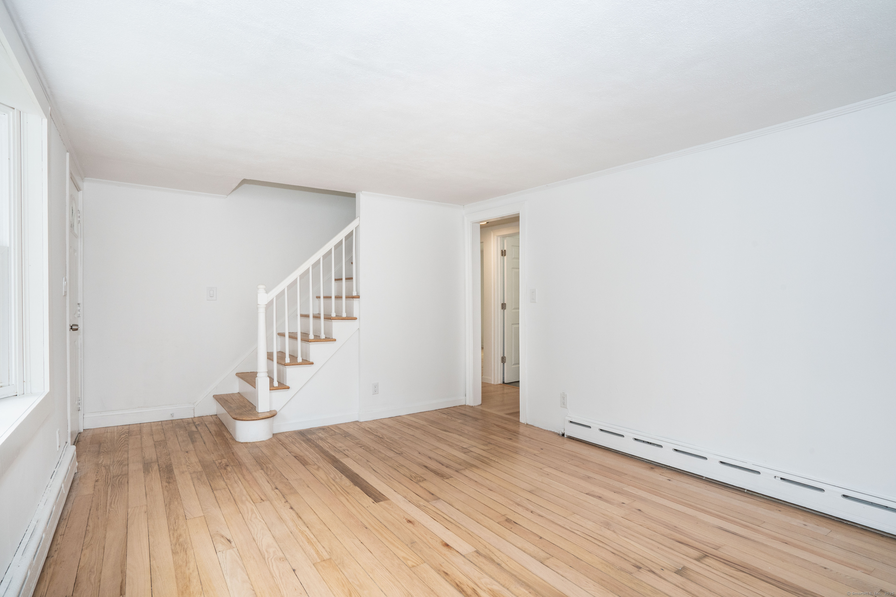14 Main St Extension Simsbury, CT 06081 - Photo 11 of 39 a view of entryway with wooden floor