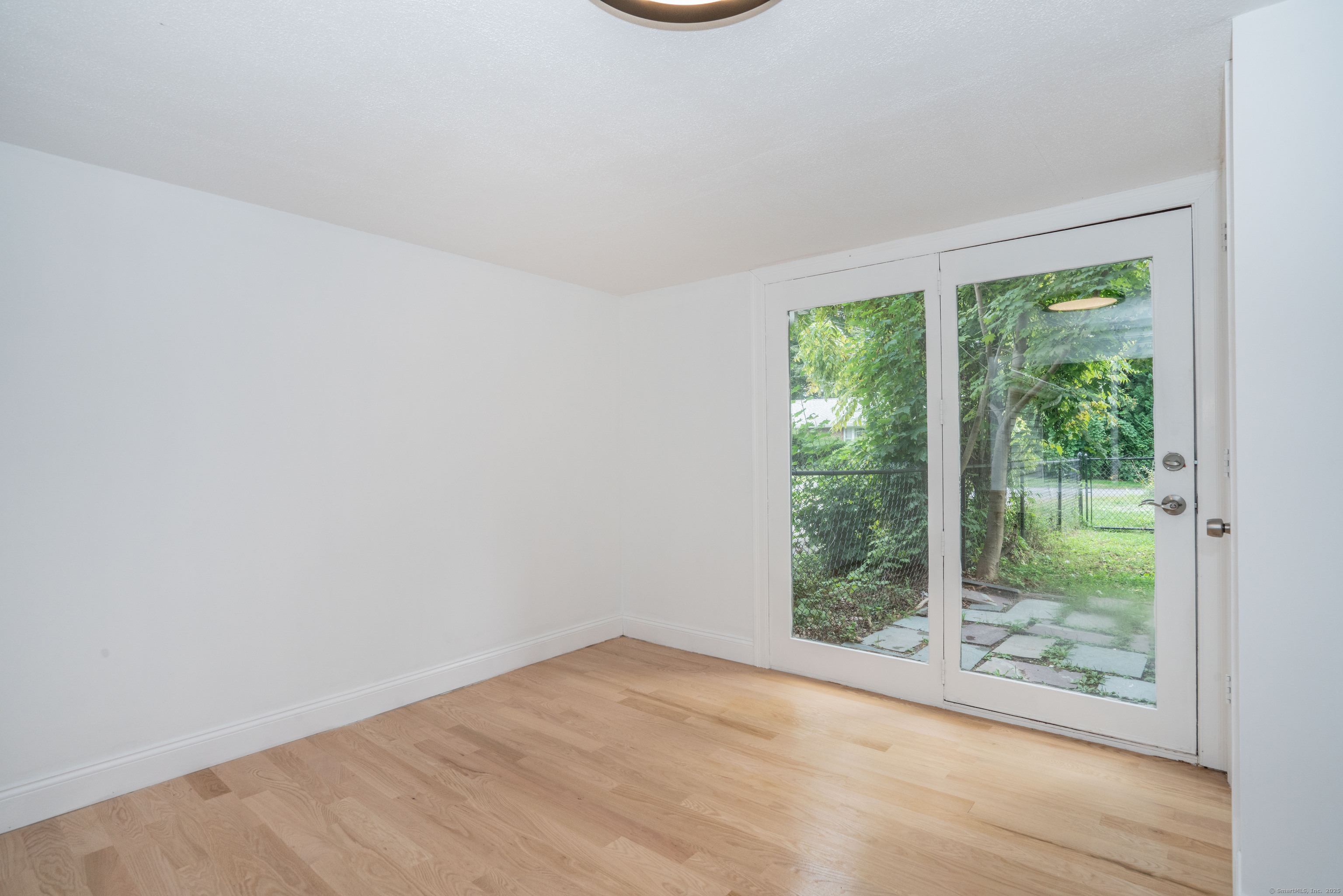 14 Main St Extension Simsbury, CT 06081 - Photo 13 of 39 a view of a small space with wooden floor and a window