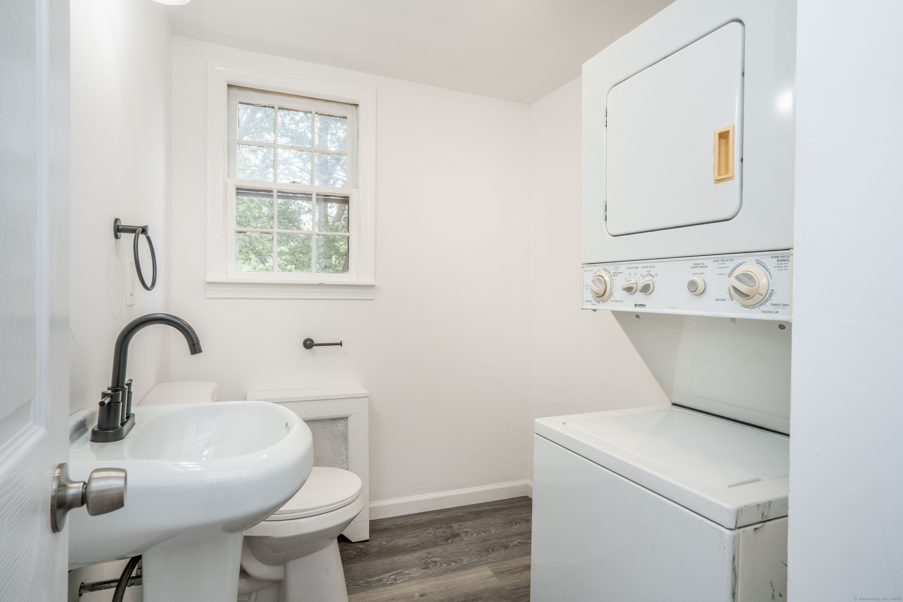 14 Main St Extension Simsbury, CT 06081 - Photo 17 of 39 a bathroom with a sink and mirror with toilet
