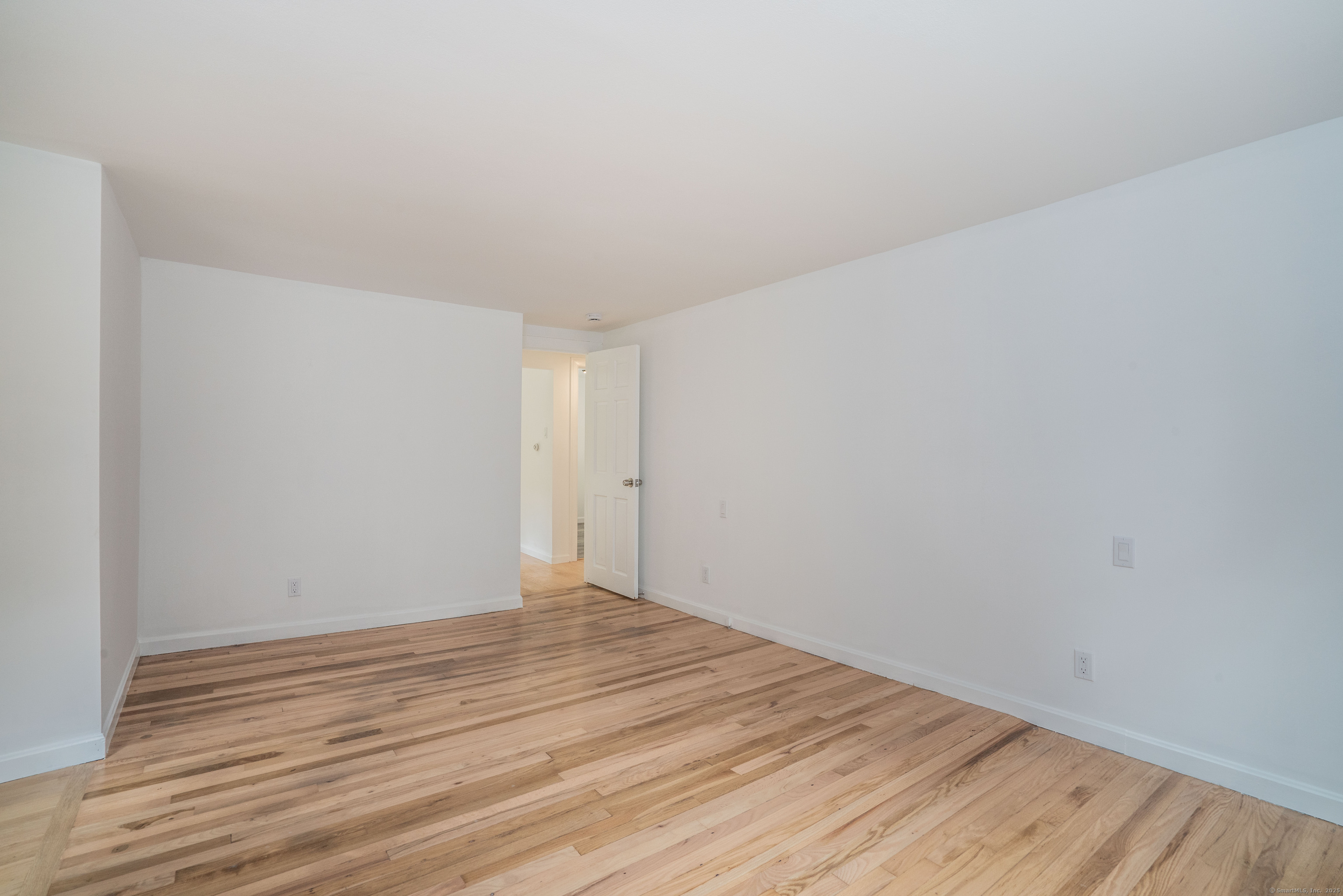 14 Main St Extension Simsbury, CT 06081 - Photo 20 of 39 a view of an empty room and wooden floor