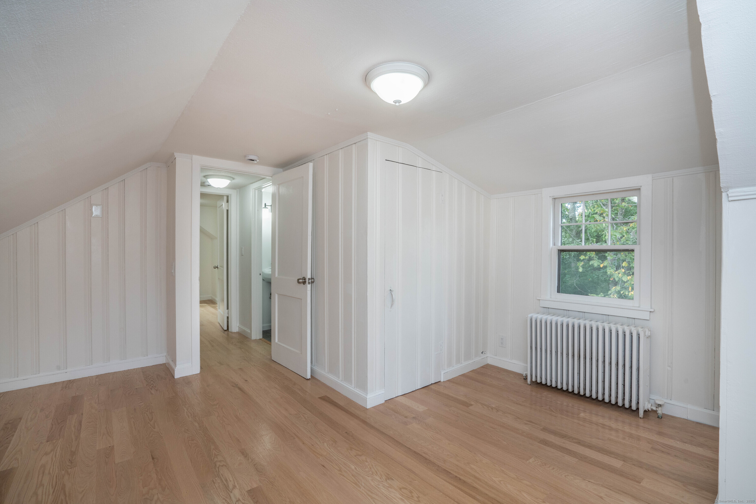14 Main St Extension Simsbury, CT 06081 - Photo 24 of 39 a view of a hallway with wooden floor and windows