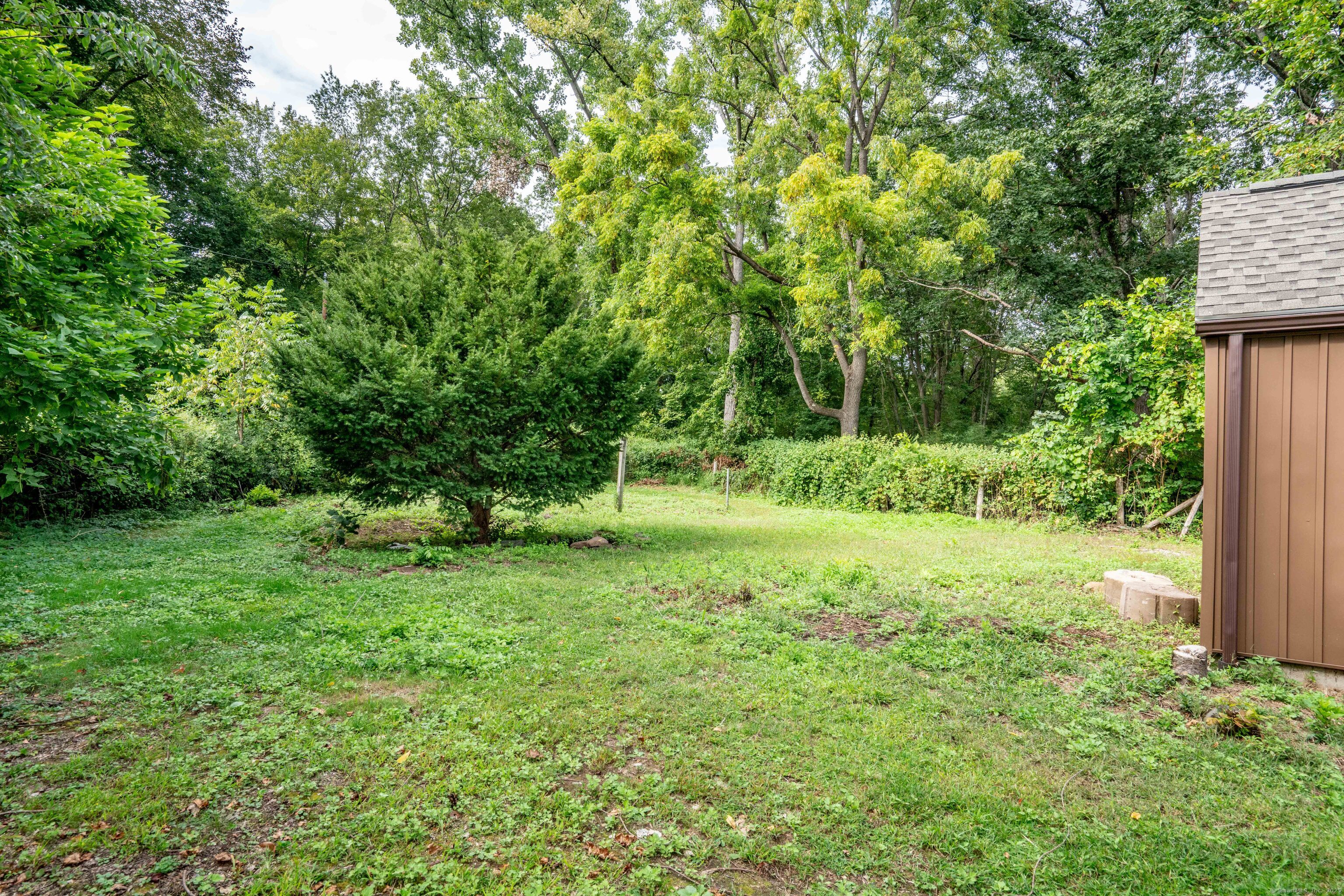 14 Main St Extension Simsbury, CT 06081 - Photo 32 of 39 a view of backyard with green space