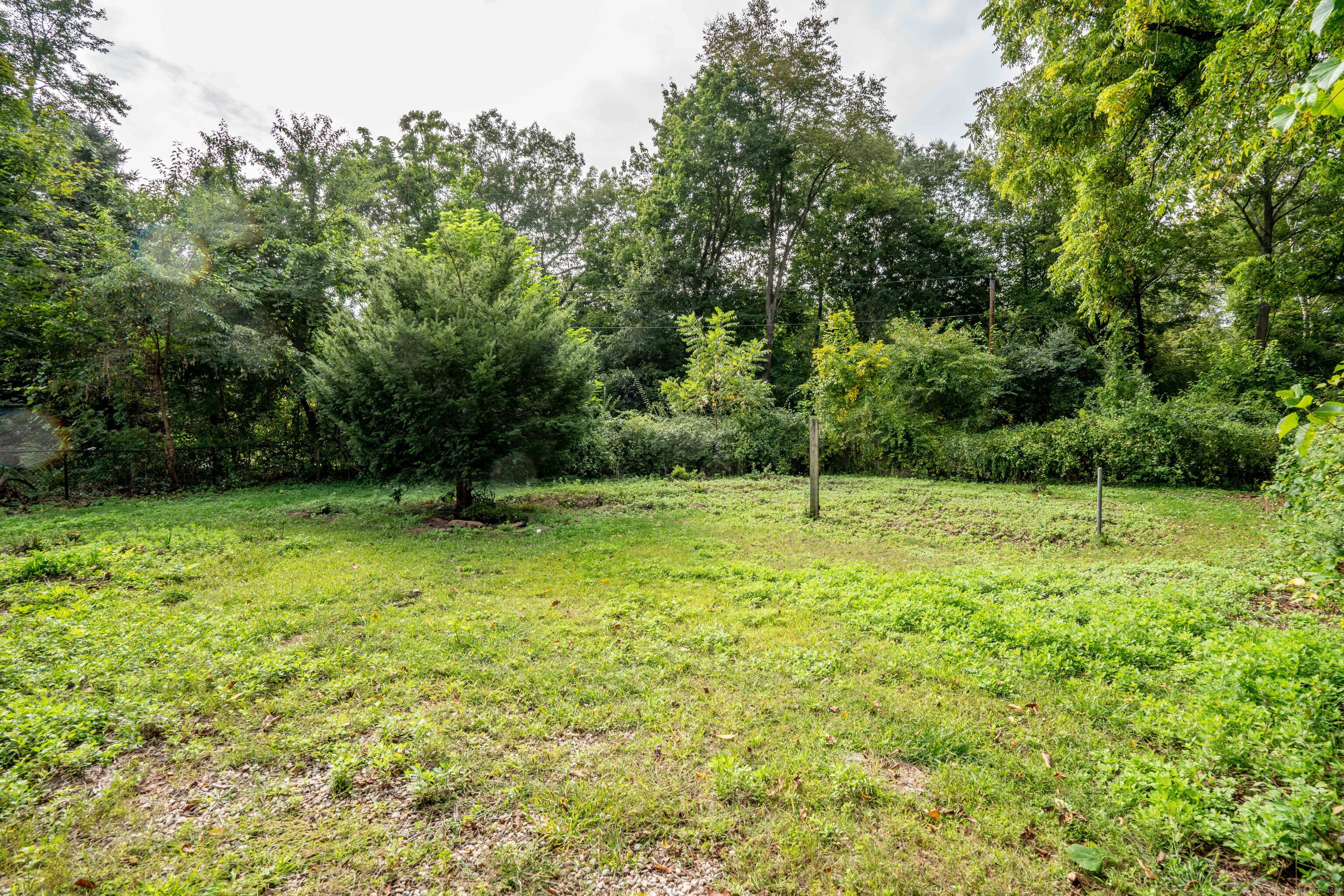 14 Main St Extension Simsbury, CT 06081 - Photo 34 of 39 a backyard of a house with lots of green space