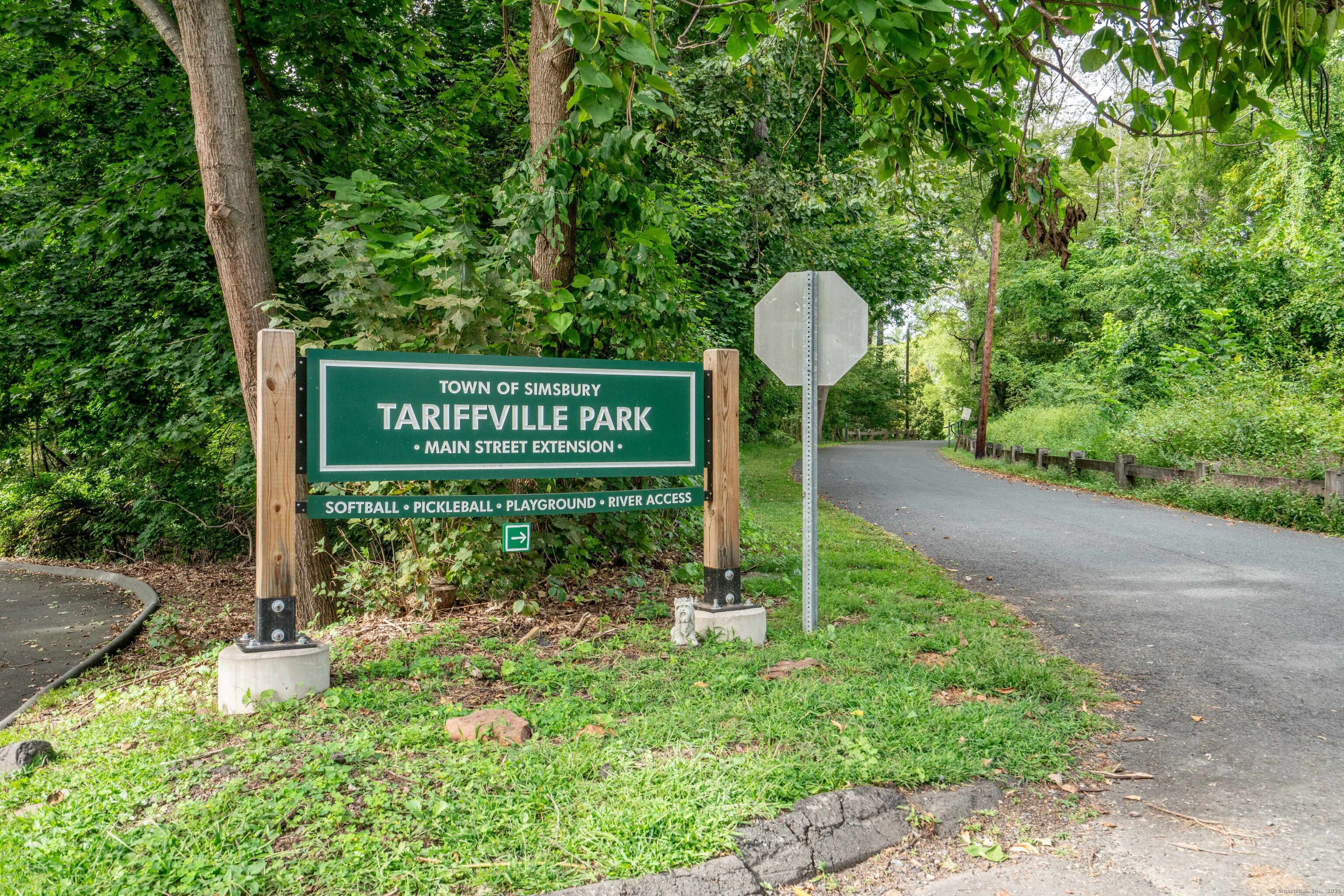 14 Main St Extension Simsbury, CT 06081 - Photo 36 of 39 a sign that is sitting on a brick wall