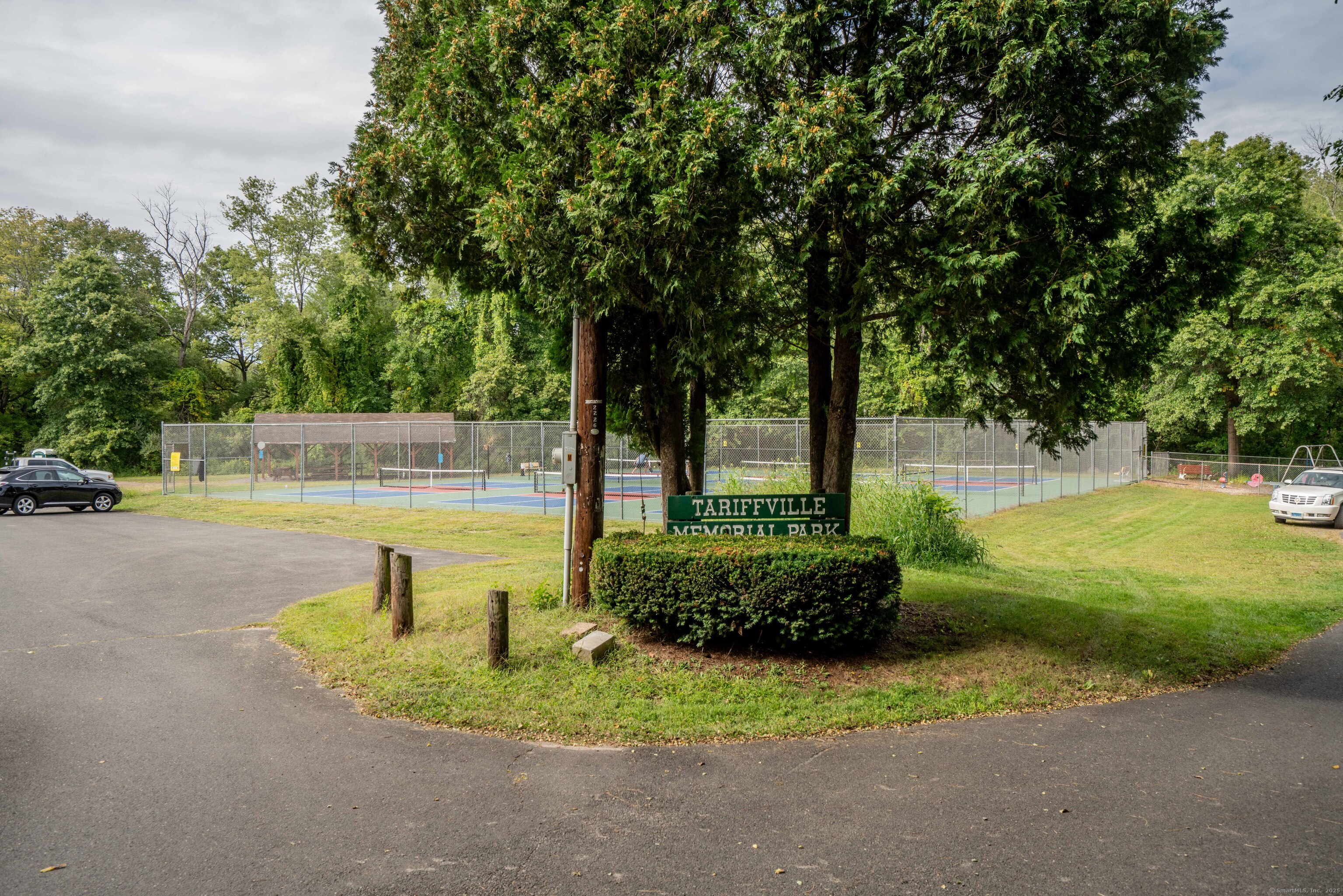 14 Main St Extension Simsbury, CT 06081 - Photo 37 of 39 a view of a garden with a bench