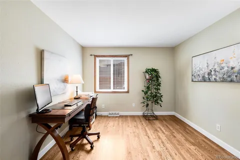 a view of a livingroom with furniture and wooden floor