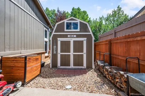 a front view of a house with a large window