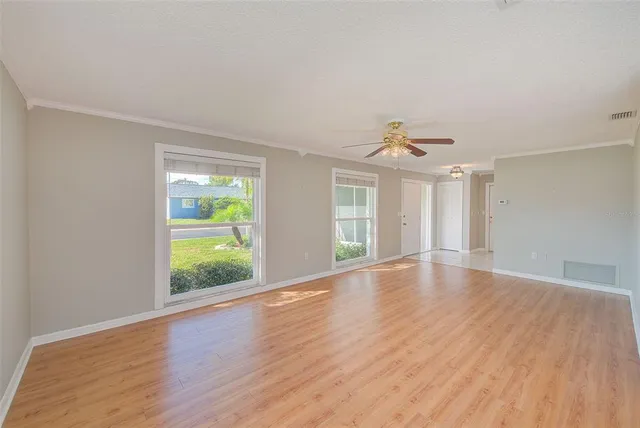 a view of an empty room with a window