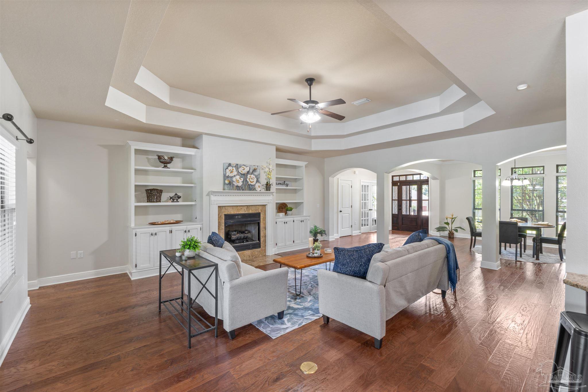 2698 Tulip Hill Road Pace, FL 32571 - Photo 17 of 65 a living room with furniture and a fireplace