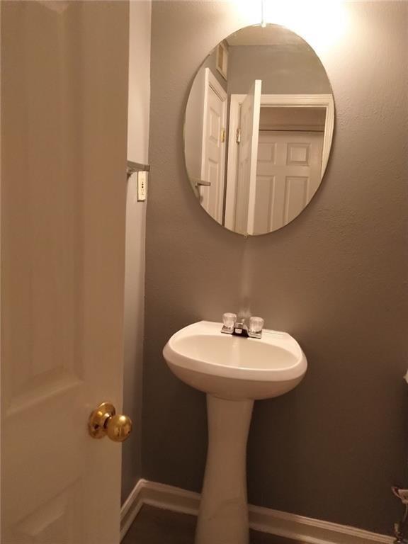 1212 Utoy Springs Road Southwest, Unit 30 South Fulton, GA 30331 - Photo 6 of 6 a bathroom with a sink toilet and a mirror