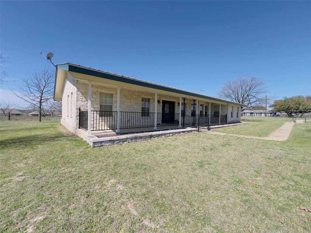 694 County Road 267 Leander, TX 78641 - Photo 1 of 1 a view of a house with backyard and porch