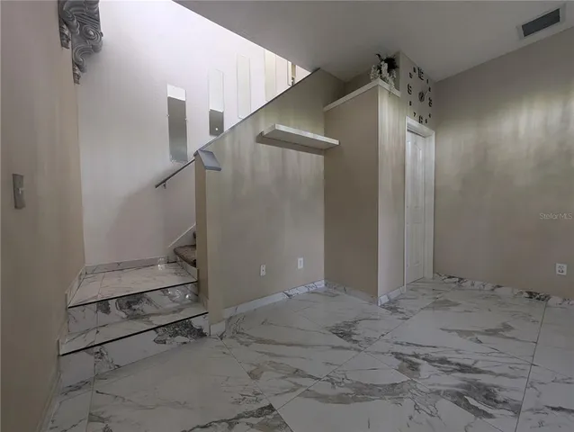 an empty room with a bench