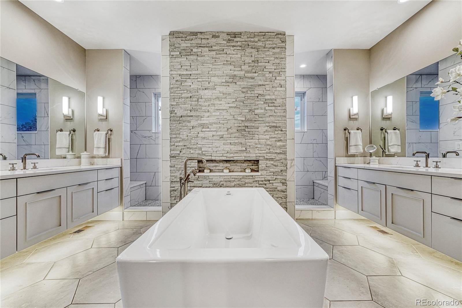 5151 Raintree Circle Parker, CO 80134 - Photo 17 of 50 a large white kitchen with a sink dishwasher stove and cabinets