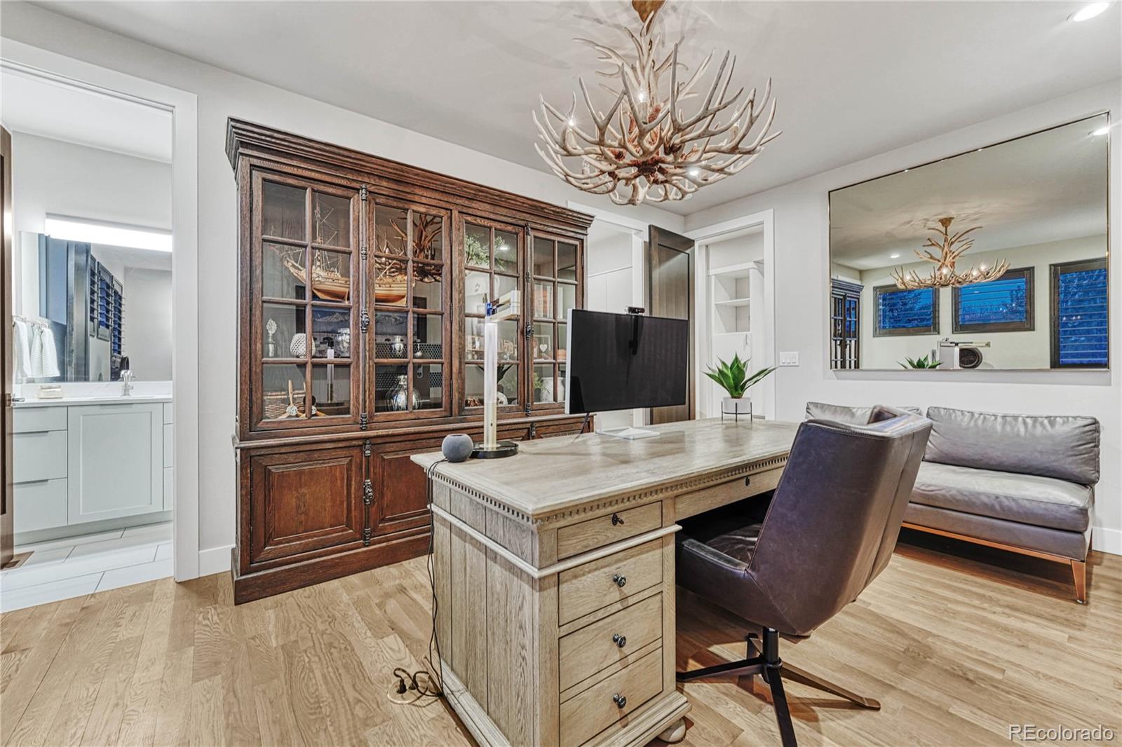 5151 Raintree Circle Parker, CO 80134 - Photo 18 of 50 a view of a dining room with furniture and wooden floor
