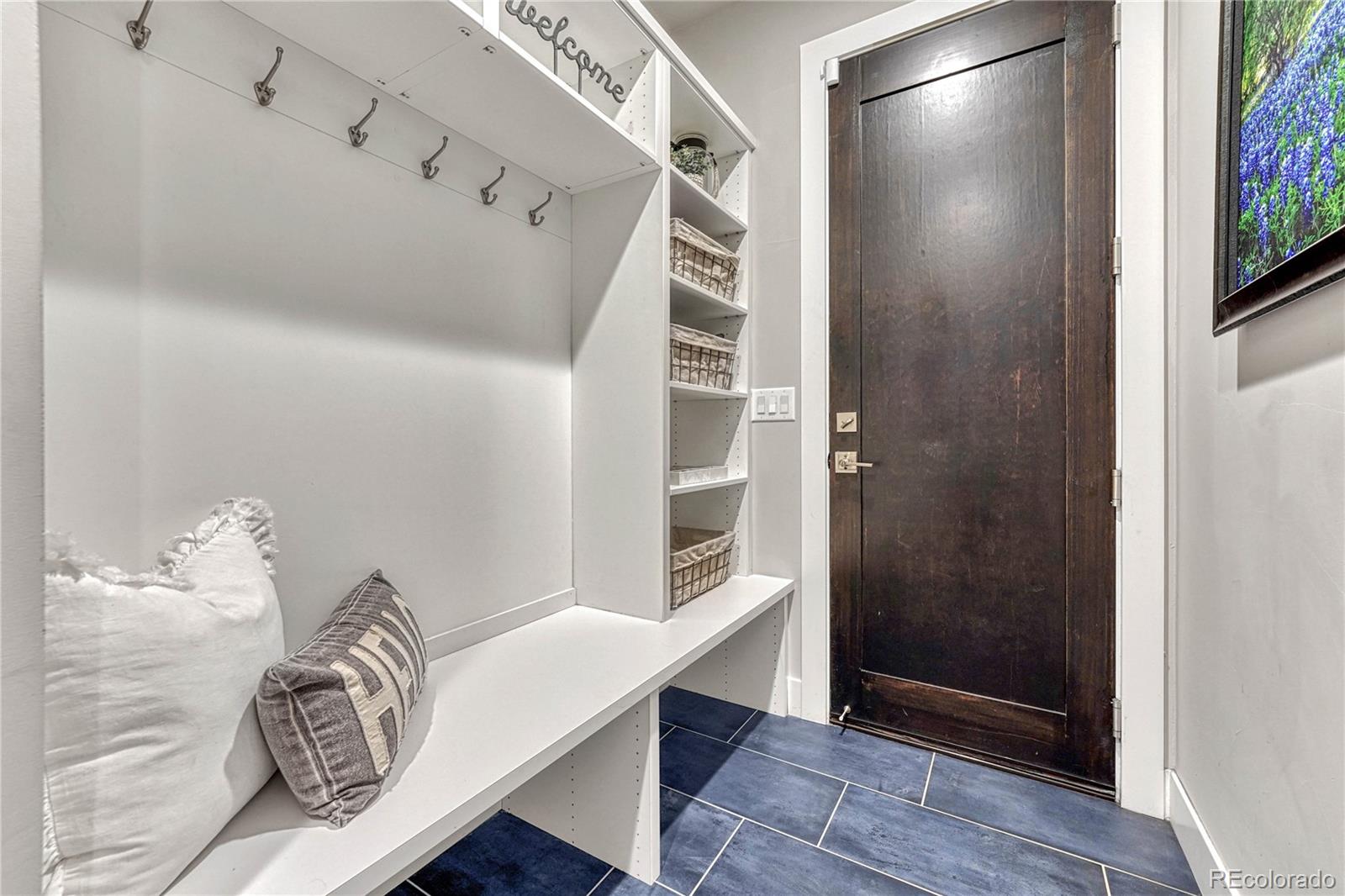 5151 Raintree Circle Parker, CO 80134 - Photo 20 of 50 a view of entryway with wooden floor