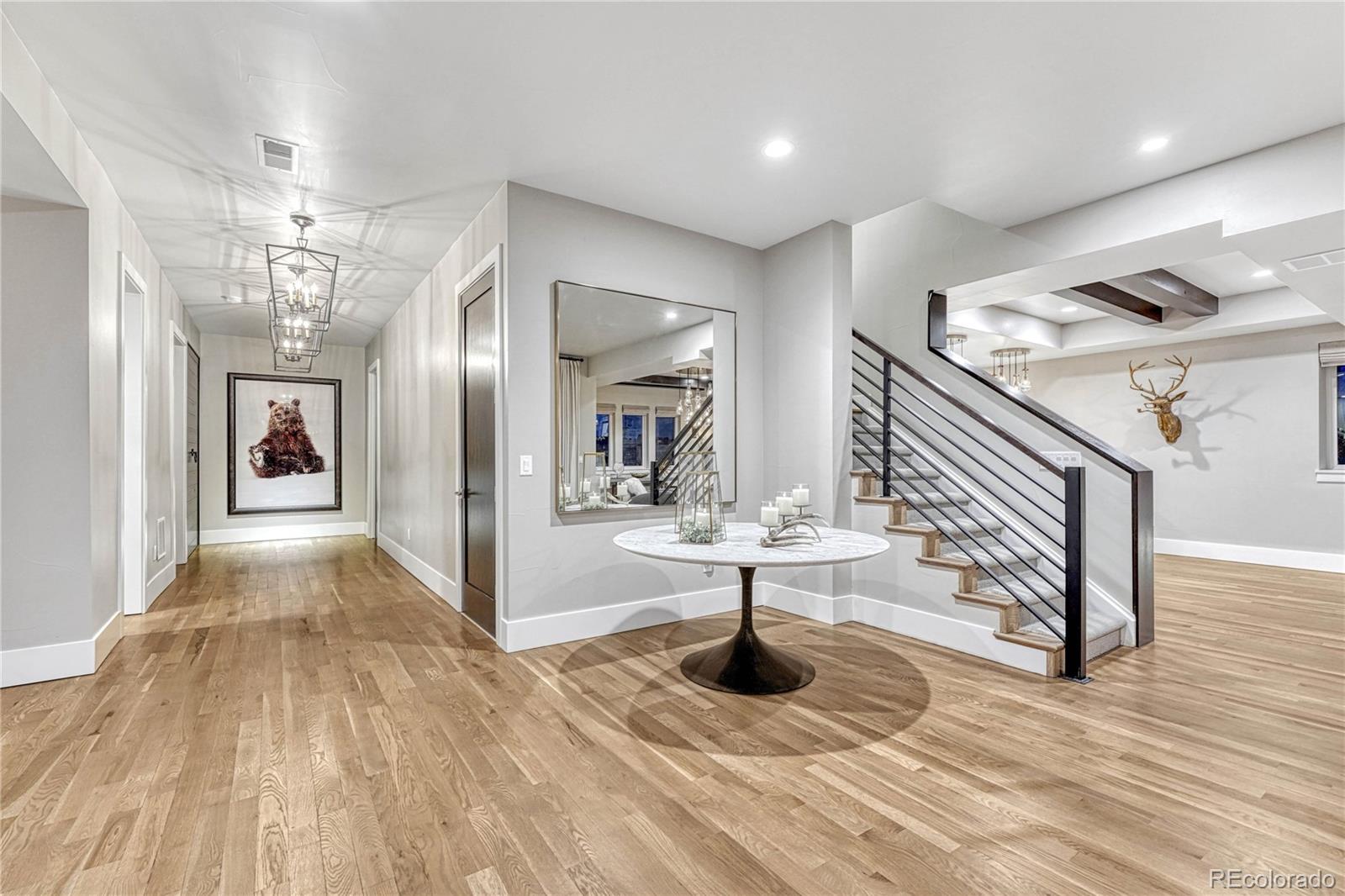 5151 Raintree Circle Parker, CO 80134 - Photo 26 of 50 a view of entryway and hall with wooden floor