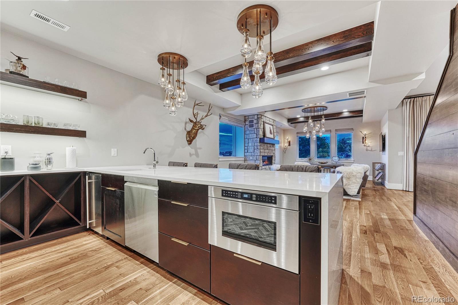 5151 Raintree Circle Parker, CO 80134 - Photo 33 of 50 a kitchen with stainless steel appliances granite countertop a stove and a sink