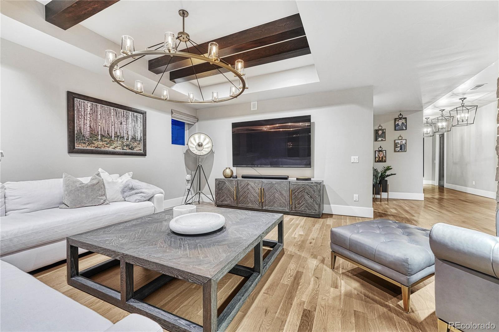 5151 Raintree Circle Parker, CO 80134 - Photo 35 of 50 a living room with furniture and a flat screen tv