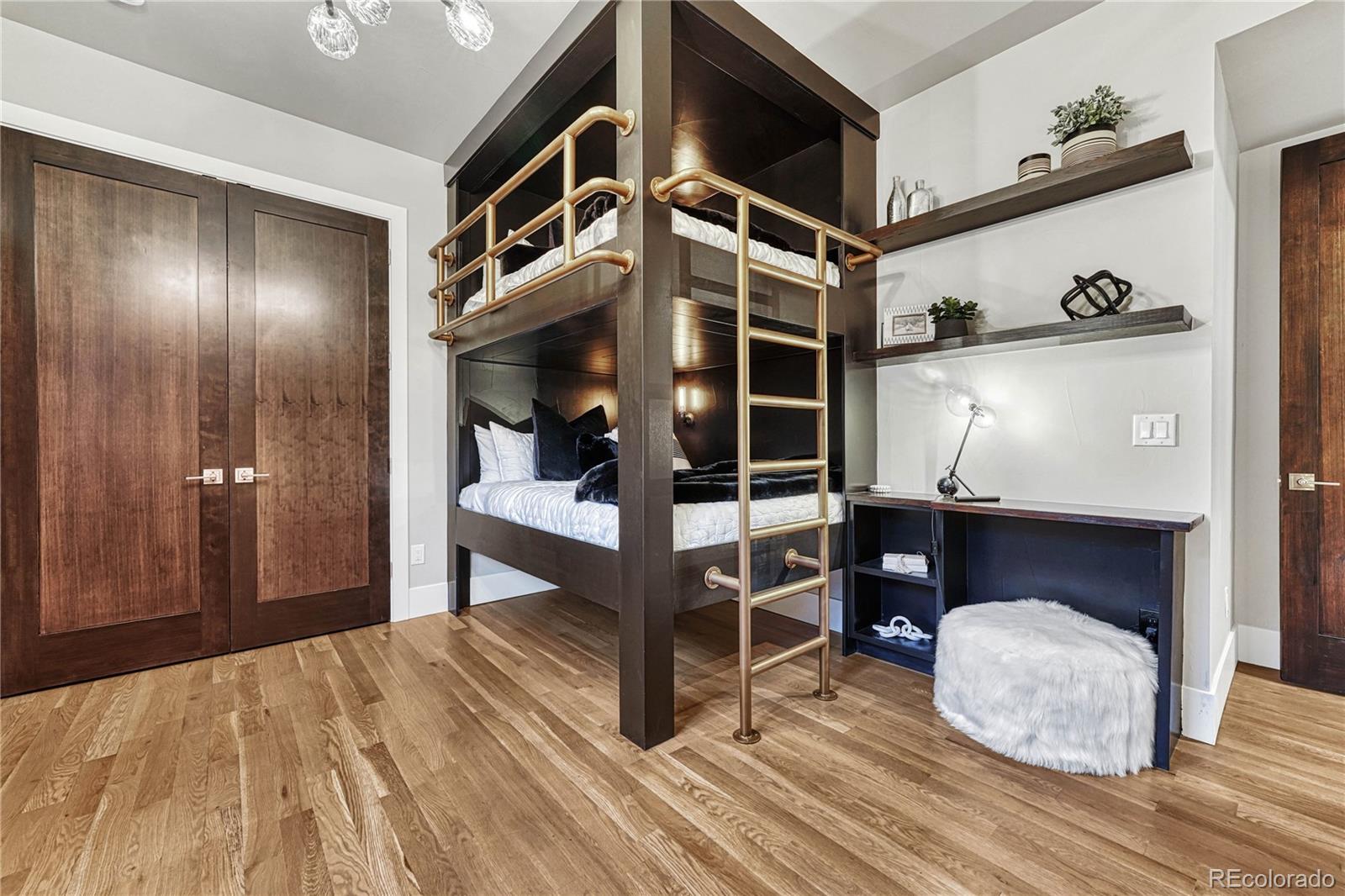 5151 Raintree Circle Parker, CO 80134 - Photo 38 of 50 a bedroom with a bed and a dresser