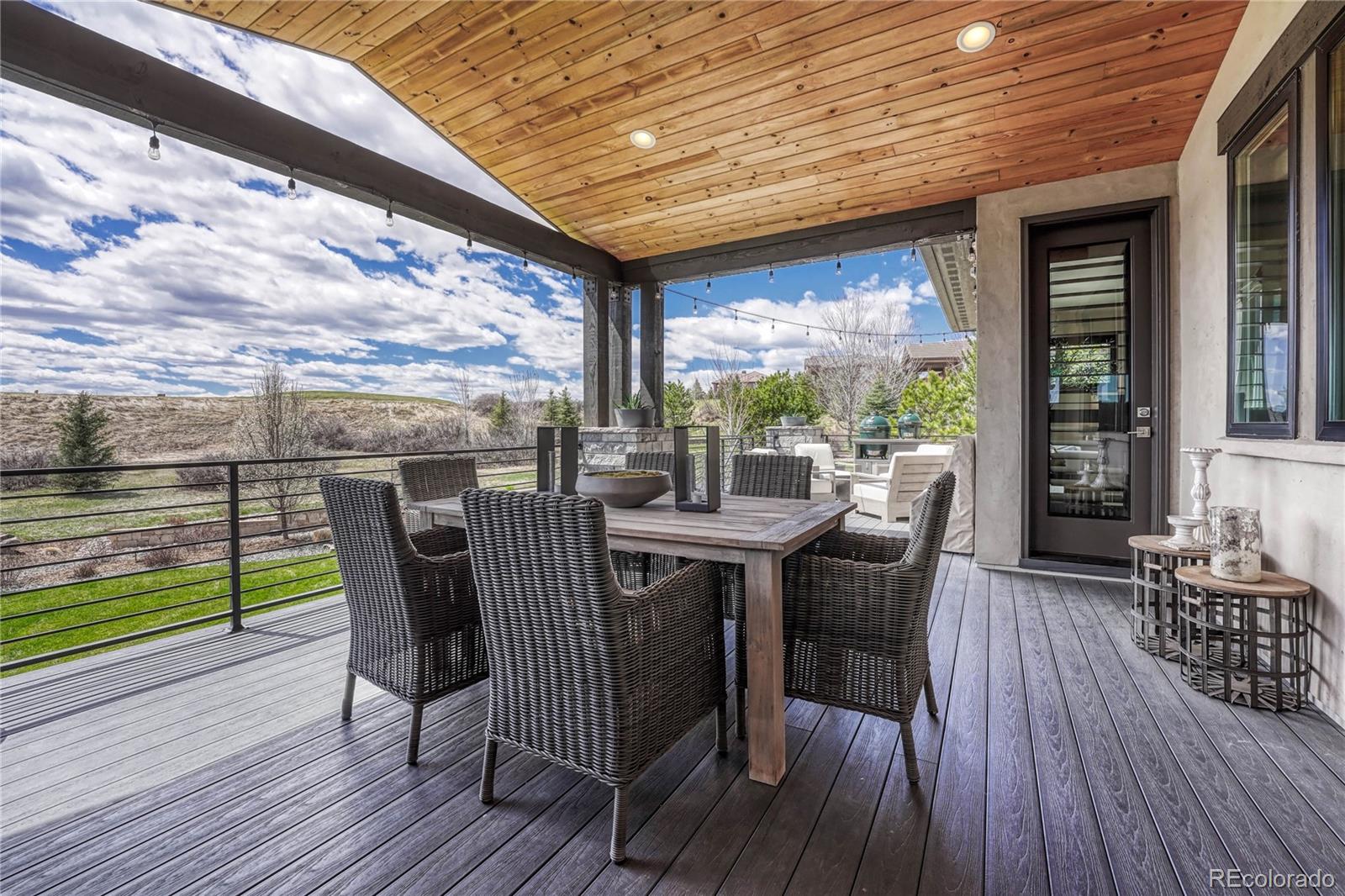 5151 Raintree Circle Parker, CO 80134 - Photo 40 of 50 a view of a dining room with furniture window and wooden floor