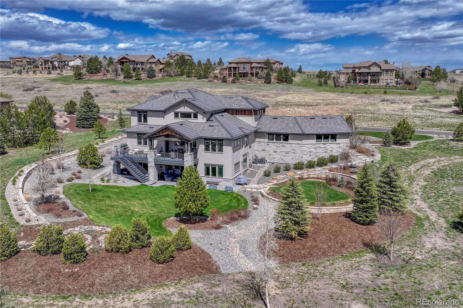 5151 Raintree Circle Parker, CO 80134 - Photo 47 of 50 an aerial view of a house with a yard